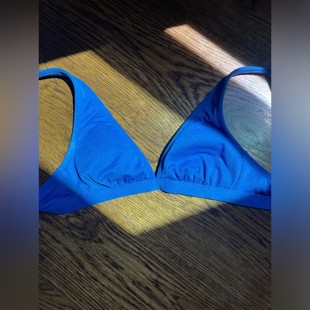 Size small bikini top from target. Pretty blue with light sparkles.